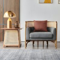 Fauteuil en rotin tressé et bambou avec coussin gris moderne tendance ALBERT