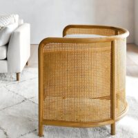 Fauteuil en rotin et bois avec coussins forme arrondie confortable ACHIL